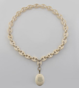 An antique carved ivory locket on an impressive carved ivory link chain, 19th century, ​​​​​​​the locket 4.5cm high, the chain 60cm long.