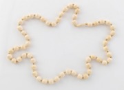 A vintage carved ivory bead necklace, early to mid 20th century, 70cm long.