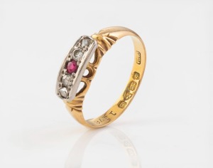 An antique 18ct gold ring, set with four diamonds and a ruby mounted in white gold surround, 19th/20th century, 2.6 grams.