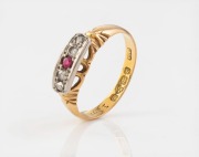 An antique 18ct gold ring, set with four diamonds and a ruby mounted in white gold surround, 19th/20th century, ​​​​​​​2.6 grams.