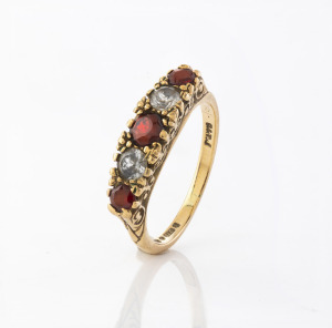 An antique 9ct gold ring, set with garnets and white stones, 19th century, 2.7 grams.