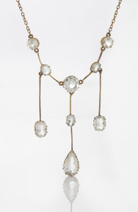 An antique 9ct rose gold negligee necklace, set with white stones, early 20th century, the chain 40cm long, the centre pendant drop 5.5cm high, 7 grams total.