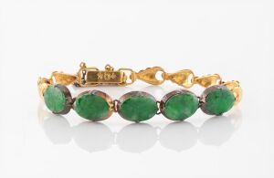 A Chinese 14ct gold bracelet, set with five cabochon jade stones, each mounted in gilded silver, stamped "14" with seal mark, 8.1 grams total.