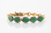 A Chinese 14ct gold bracelet, set with five cabochon jade stones, each mounted in gilded silver, stamped "14" with seal mark, ​​​​​​​8.1 grams total.