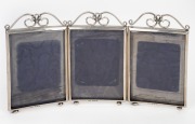 An antique English sterling silver three-fold picture frame, made in Birmingham, circa 1897, ​​​​​​​18cm high, 32.5cm wide.