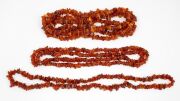 Three assorted amber bead necklaces, 20th century, ​​​​​​​the largest 165cm long.