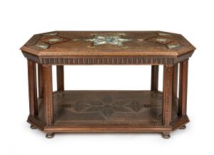 An antique Moroccan walnut centre table banded with thuya wood and inlaid hand-painted Islamic tile decoration, 19th century, 77cm high, 150cm wide, 90cm deep.