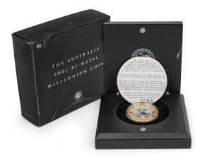 BI-METAL MILLENNIUM COIN: 2001 Perth Mint $20 coin featuring outer ring of 0.3054oz pure gold surrounding inner silver plug, in presentation case with box and CoA.