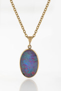 A 9ct gold mounted opal doublet pendant on gold chain, 20th century, the chain 50cm long.