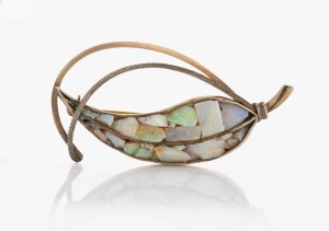 A vintage Australian silver and opal brooch in the form of a gum leaf, mid 20th century, 5.5cm wide.