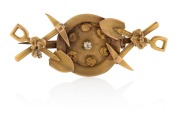 An antique Colonial 15ct gold miner's brooch comprising of a gold pan filled with six gold nugget specimens adorned with a white diamond and flanked by two sets of crossed picks and shovels, housed in a fitted box branded "HORACE BRADLEY, Watchmaker & Jew