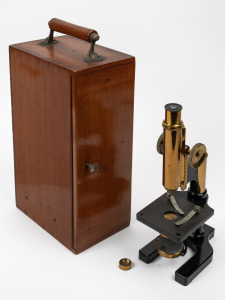 An antique English brass microscope in original mahogany case, early 20th century, ​​​​​​​the case 41cm high.