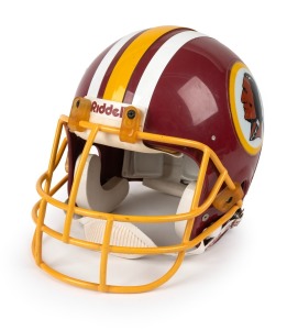 19 · NFL - REDSKINS: Full-size 1989 Riddell gridiron helmet (size L), with the now defunct logo on either side and "Meets NOCSAE Standard" inscription on rear.