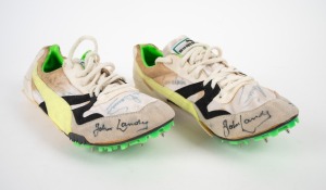 OLYMPIC MIDDLE-DISTANCE RUNNERS: Pair of Puma spiked running shoes, each with six signatures in identical positions, including those of John Landy, Roger Bannister, Sebastian Coe, Ron Clarke, and others. (2 items)