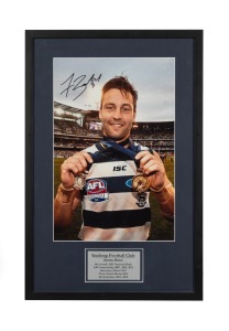 GEELONG: Signed and framed photograph of Jimmy Bartel, showing his 2011 Norm Smith Medal and Premiership Medal, accompanied by CoA; framed and glazed, overall 66 x 43cm.
