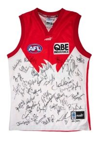 AFL "On-Field Team Gear" Sydney Swans guernsey, signed by more than forty members of the c. 2000 Swans roster, including Paul Kelly, Adam Goodes, Andrew Schauble, and others.