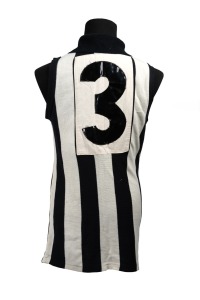 1964 COLLINGWOOD GUERNSEY: Short-sleeved guernsey with tag that reads "A Mascot Production Made Expressly For Meret - Thorold Merrett's Sports Store Melbourne", number 3 stitched in vinyl on back panel. Ken Turner played as number 3 for Collingwood in that year.