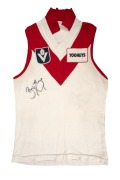 Bernie Evans' c. 1984 short-sleeved South Melbourne Swans VFL guernsey, VFL logo and Tooheys branding on front, number 15 on back; Evans signature present on both front and back.