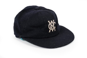 215 · KEITH STACKPOLE'S VICTORIAN TEAM CRICKET CAP: Circa 1960s baggy blue, embroidered "VCA" logo on front, fair condition.