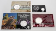 CARDED SILVER COINS: Group of four coins comprising 2014 RAM For Valour - The Victoria Cross For Australia 1oz, 2015 RAM Australian Lighthouses 1oz, 2020 PM End Of World War II 1/10oz, and 2020 PM Brisbane Money Expo ANDA Special Kookaburra 1oz (floral pr