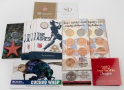 Diverse group of twelve RAM carded uncirculated issues, including 2014 Australia At War - The Western Front 50c (coloured), 2012 Lunar Year Of The Dragon 50c, 2014 Cuckoo Wasp $1 (coloured), and others.