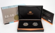 FIFTY YEARS OF THE ROYAL AUSTRALIAN MINT: Two-coin set comprising 2015 50c "C" Mintmark proof, together with ultrasonically cleaned 1966 round 50c coin; offered in presentation case with box and CoA.