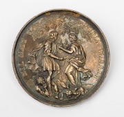 GERMAN STATE: AUGSBURG, silver gilt wedding medal, by Phillip Heinrich Mueller, circa 1700, (50mm, 44g) depicting two newlyweds under a tree with vine branches, chained and exchanging hearts; at their feet, two demons.
