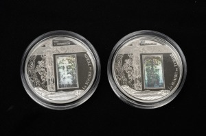 Cameroon: SILVER PROOFS - SHROUD OF TURIN: Two 2010 "Le Suaire De Turin" 1000 CFA franc coins, each 20g sterling silver with holographic accent, both in coin capsules, with one CoA. (2).