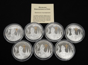 Congo (Brazzaville): SILVER PROOFS - POPE BENEDICT XVI IN COLOGNE: Group of seven Democratic Republic of the Congo 2005 10 Congolese franc coins, each 25g 925/1000 silver with gilded cross accent, all in coin capsules, with one CoA.