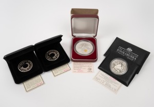 SILVER KOOKABURRAS: Group of four Perth Mint issues, all in presentation cases with CoA, comprising 1993 1oz Kookaburra proof, 1996 2oz Star Pagoda Kookaburra, together with two 1992 NAA Australian International Coin Fair Sydney Sesquicentenary 1oz Holey Dollar commemorative medallions.