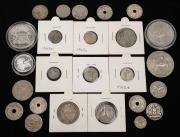 An accumulation of twenty-five world coins, mostly silver, from years dating 1925 to 2013; mixed condition. (25 items)