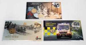 RARE PNC OVERPRINTS: Group of three PNCs comprising 2017 $1 "Women In War - A Century Of Service" limited edition 147/250 overprinted "Remembrance Day - Brisbane Stamp & Coin Show", 2017 $1 "The Australian Light Horse" limited edition 115/500 overprinted "ANDA Brisbane Money Expo", and 2022 $2 "Australian Ambulance Services" limited edition 081/100 overprinted "Canberra Stamp Show 2022".