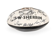 COLLINGWOOD: Circa 1977 black and white Sherrin football signed by twenty-two players, including Len Thompson, Lex Pritchard, Gerald Betts, Stan Magro, Shane Bond, Peter Moore, Andrew Ireland, and others.
