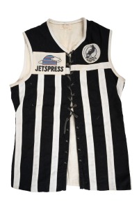 PORT ADELAIDE MAGPIES: Early 1990s lace-up guernsey, "Magpies Port Adelaide Football Club SANFL" and "Jetspress" patches on front, number 11 on back, "Vic Hill Premiership Football Jacket, Adelaide" tag at collar.