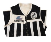 PORT ADELAIDE MAGPIES: Early 1990s lace-up guernsey, "Magpies Port Adelaide Football Club SANFL" and "Jetspress" patches on front, number 11 on back, "Vic Hill Premiership Football Jacket, Adelaide" tag at collar. - 3