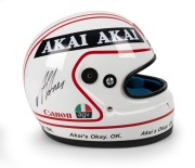 ALAN JONES' RACING HELMET: A race-worn helmet (Snell SA85), signed by Alan Jones, with AGV, AKAI, Canon, and Marlborough sponsorship decals, worn by Jones in an unspecified race, and accompanied by a copy of an email from him certifying this to be a "genu - 2