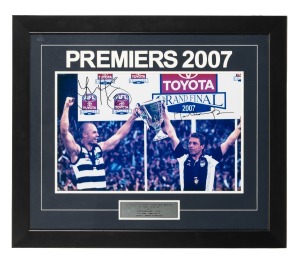 GEELONG: 2007 Premiership photographic display, depicting captain Tom Harley and coach Mark Thompson celebrating the largest-ever AFL Grand Final winning margin of 119 points; signed by Harley and Thompson, attractively framed and glazed, 55.5 x 65.5cm overall.