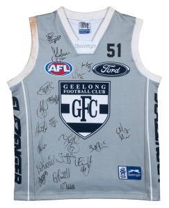GEELONG: Match-worn clash/away guernsey signed by the 2005 team, attractively framed and glazed, together with various Geelong Football Club membership fobs, 90 x 71cm overall.
