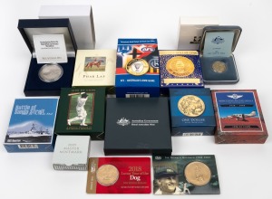 BOXED PROOFS: Group of eight proofs, all in original packaging, including 1984 One Dollar First Year Of Issue, 2014 One Dollar World Money Fair Special Release, and 2014 AFL Australia's Own Game $5 selectively gold-plated, together with five uncirculated coins in their original packaging. (13 items)