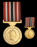 NEW ZEALAND: 1990 New Zealand Commemoration Medal, with ribbon in case of issue; together with the miniature. (2 items). - 2