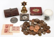 A medium box containing an accumulation of Australian and foreign coins, a circa 1970 Melbourne Moomba Festival medal by Stokes, a souvenir bell from the Orsova, a leather purse, a few stamps, a silver-framed photograph, etc.
