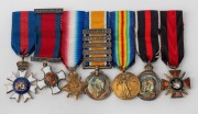 UNITED KINGDOM: A ribbon bar of seven miniature medals comprising Most Distinguished Order of St. Michael & St. George; Distinguished Service Cross; WW1 Medal - 5 clasps including Gallipoli; WW1 Victory Medal; KEVII Coronation Medal & Russian Order of Sai