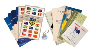 A group of 1956 Melbourne Olympics ephemera, including a rare Pan American Airways luggage tag with text "XVIth Olympic Games - Melbourne, Australia", official programmes, pamphlets, a bank cheque, and other items. (12 items)