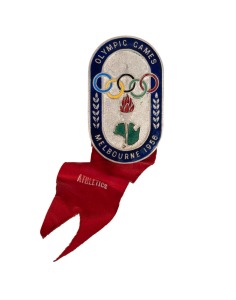 1956 MELBOURNE: OFFICIAL BADGE FOR ATHLETICS OFFICIAL, by K.G.Luke, with blue enamel border, silver background and original red ribbon with "ATHLETICS", numbered "2074" on reverse; together with two special Athletics Programmes (26th November and 1st December) for officials and three pads headed "Time Recordings by Racend-Omega Timer" filled-in and dated in manuscript 28th, 29th and 30th November. (6 items). The results recorded include Shirley Strickland's Gold Medal in the 80m Hurdles.