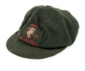 WILLIAM ALBERT (Bert) OLDFIELD (1894-1976) New South Wales & Australia 1919 - 1938: Oldfield's Australian green wool "baggy green" Test cap with Australian shield to front panel with kangaroo and emu embroidered in metal thread and coloured thread, with the legend ‘ADVANCE AUSTRALIA’ in the scroll; worn by Oldfield in the 1924/25 Ashes series played in Australia. The cap, made by Harding’s Mercery, Hunter Street, Sydney, with original label inside with "W.A. OLDFIELD" in black ink.