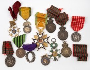 FRANCE: A small accumulation including the St. Helena 1821 Medal (4 examples), 1859-60 Napoleon III silver medal for Campaigns in Italy, "Valeur et Discipline" 1870 medal, Exposition Lyon 1897 star, and others. (Total: 12; mixed condition).