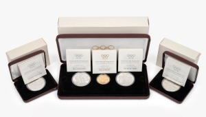IOC CENTENNIAL COIN PROGRAMME: RAM 1993 three-proof set comprising $200 22ct gold "The Gymnast", $20 sterling silver "The Champions", and $20 sterling silver "The Relay Team", together with National Mint of Greece 1000 drachma sterling silver "Ancient Wrestlers" and "Ancient Runners". (3 items)