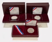 United States of America: SILVER DOLLAR PROOFS: Group of coins, all in presentation cases with box, comprising three different 1995 Atlanta Olympics motifs (running, gymnastics, and discus). (3 items)