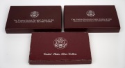 United States of America: SILVER DOLLAR PROOFS: Group of coins, all in presentation cases with box, comprising three different 1995 Atlanta Olympics motifs (running, gymnastics, and discus). (3 items) - 2