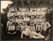 SOUTH MELBOURNE SWANS 1880s: Official team photograph taken at South Melbourne Cricket Ground, showing players wearing the blue and white uniforms that predated the club's shift to red and white; mounted on backing card, 24.5 x 30.5cm overall, together wi